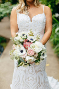 Romantic Florida Bride Holding Garden Inspired Wedding Bouquet with Light Pink Peonies, Blush King Protea, Bride Wearing Hayley Paige Lace Wedding Dress