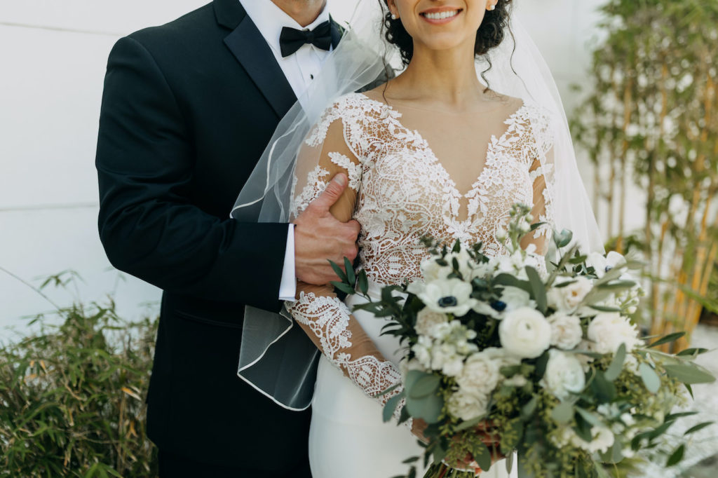 Classic St. Petersburg Bride and Groom Wedding Details, Bride Wearing Illusion Lace Long Sleeve Martina Liana Wedding Dress, Holding Timeless White Anemone Floral Bouquet with Greenery | Florida Wedding Planner Blue Skies Weddings and Events