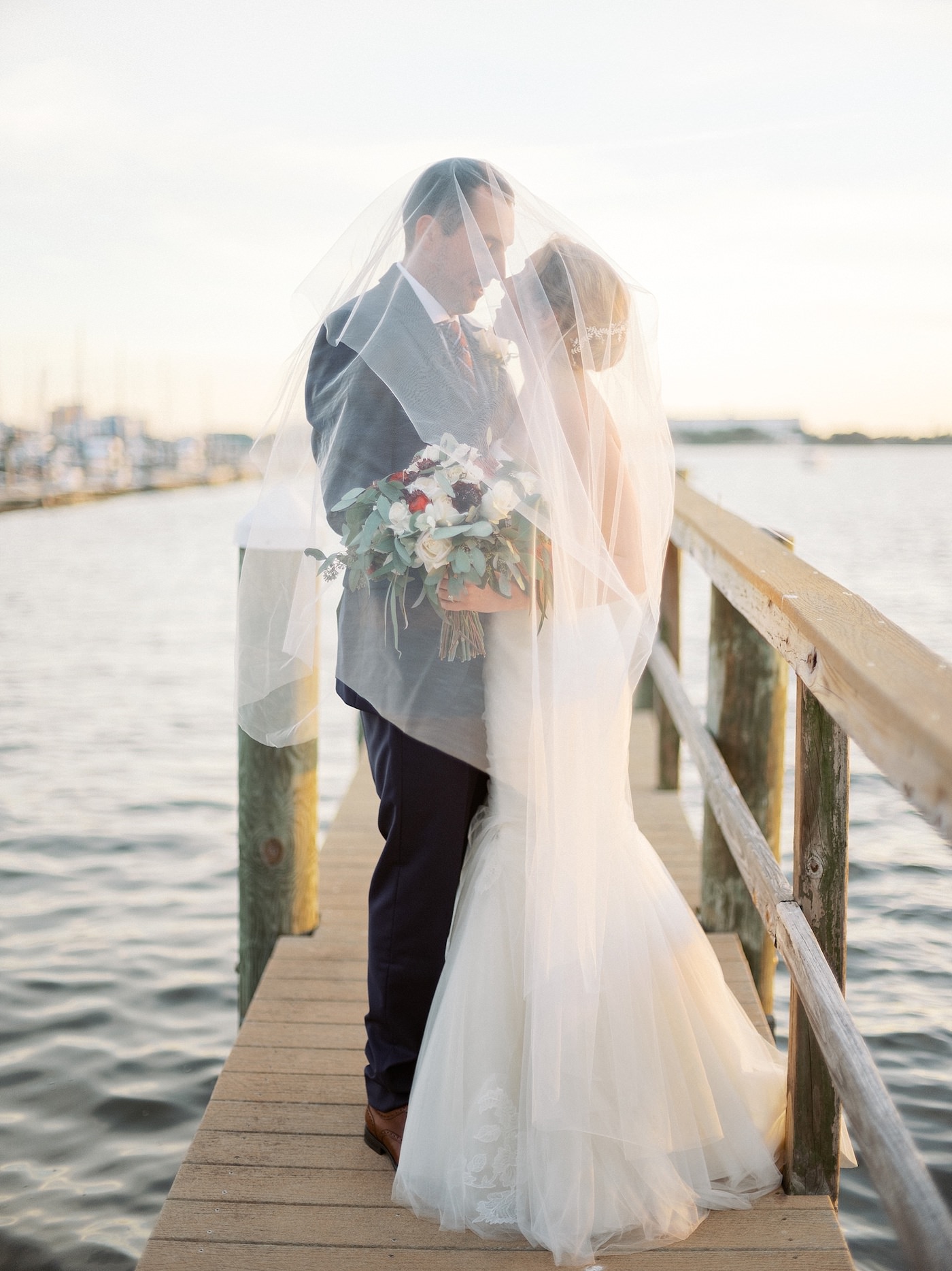 Bride and Groom Outdoor Dock Portrait | Florida Fall Autumn Waterfront Wedding | Bride and Groom Veil Shot