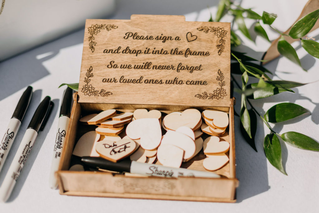 Florida Wedding Guestbook and Gift Table | Unique Pi Day Wedding Idea, Guests Sign Wooden Hearts to Display in Circular Frame | St. Pete Beach Wedding Planner Blue Skies Weddings and Events | Rentals Gabro Event Services