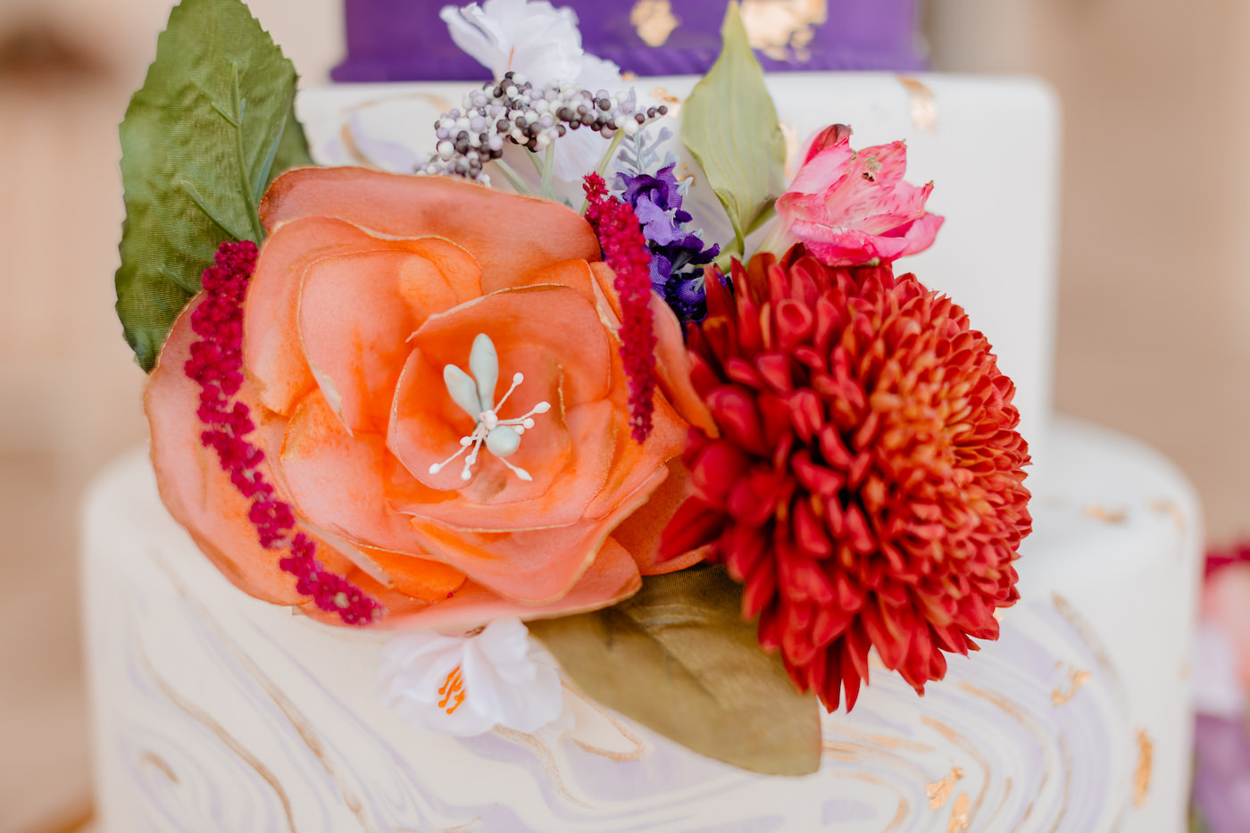 Boho Glam Wedding Cake | Three Tier Purple Marbled Fondant Wedding Cake with Golf Leaf Flecks and Jewel Tone Red and Orange Roses