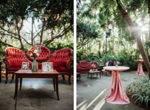 Wedding Cocktail Hour Lounge Area, Antique Red Velvet Love Seat, Wooden Coffee Table with Colorful Floral Arrangement, Tall Cocktail Table with Pink Linen | St. Pete Wedding Venue Sunken Gardens