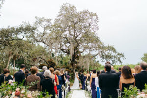 Romantic Florida Wedding Outside in Garden Inspired Ceremony Under Large Tree with Hanging Moss | Sarasota Wedding Planner NK Weddings | Marie Selby Botanical Gardens