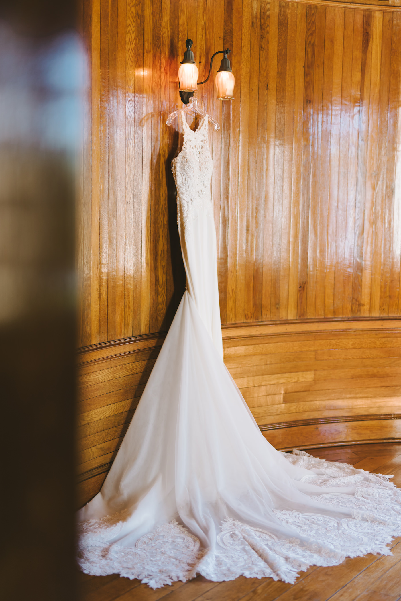 Romantic Lace Wedding Dress Hanging in Historic Powel Crosley Estate in Sarasota | Florida Wedding Photographer Kera Photography
