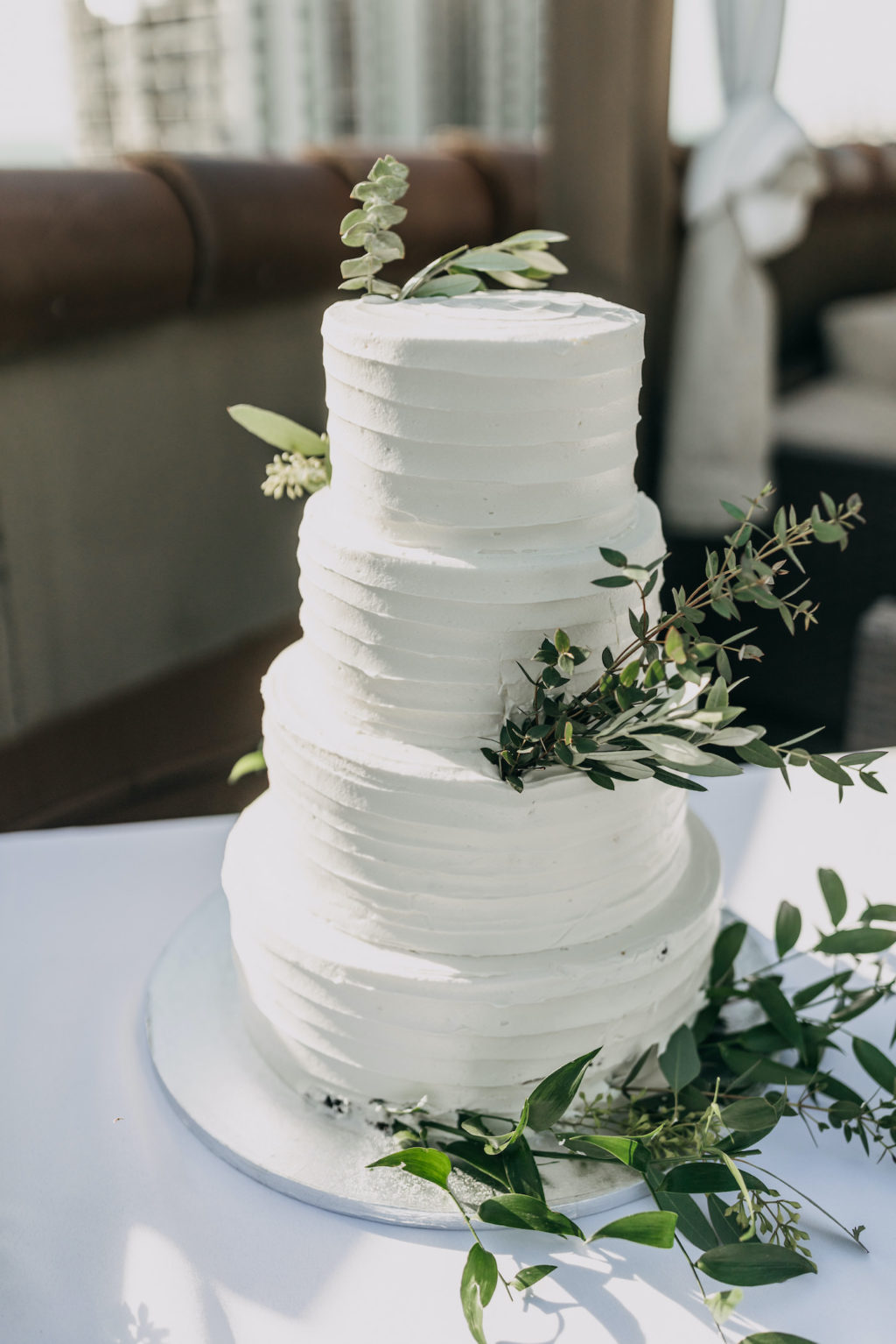 Classic Four Tier Wedding Cake, White Textured Publix Wedding Cake with Floral Accents and Greenery | Florida Boutique Hotel Wedding Venue The Hotel Zamora