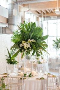 Tropical Tampa Florida Wedding Reception | White Wedding Reception Table with Silver Chiavari Chairs and Tall Tropical Palm Leaf Centerpiece with White Orchids | Tampa Wedding Florist Bruce Wayne Florals