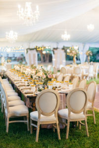 Elegant Florida Wedding Decor and Reception, Long Feasting Table for Wedding Party, Modern Circle Back Chairs, Crystal Chandeliers, Luxurious Blush Pink Florals and Greenery, Gold Table Setting Accents | Sarasota Wedding Planner NK Weddings | Marie Selby Botanical Gardens