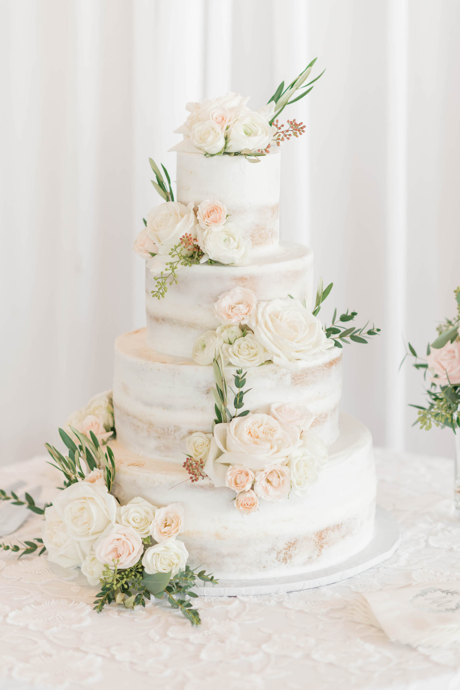 Semi Naked Four Tiered Wedding Cake with Real Ivory and Blush Pink Roses