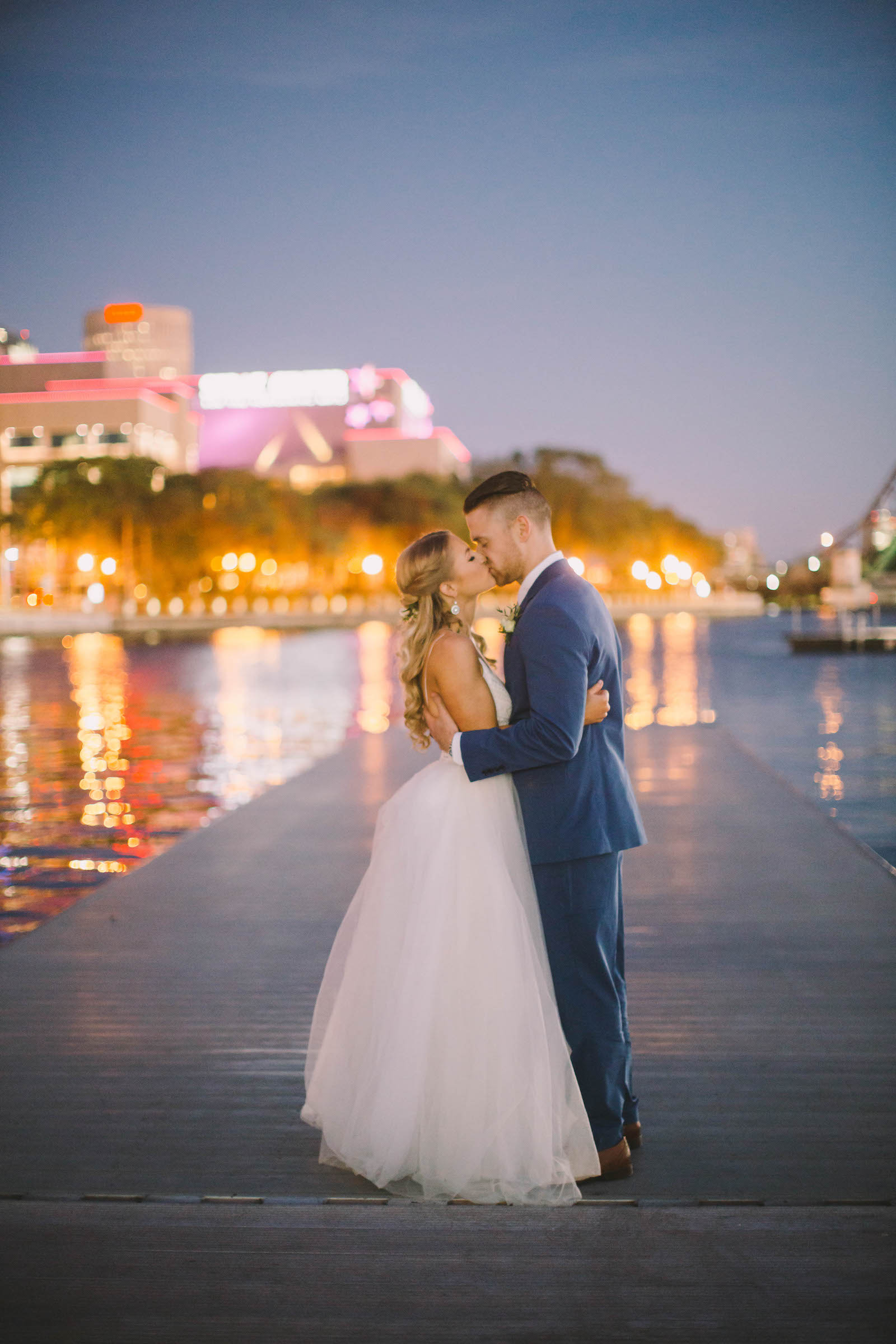 Tampa Waterfront City Lights Bride and Groom Wedding Portrait on Boat Dock