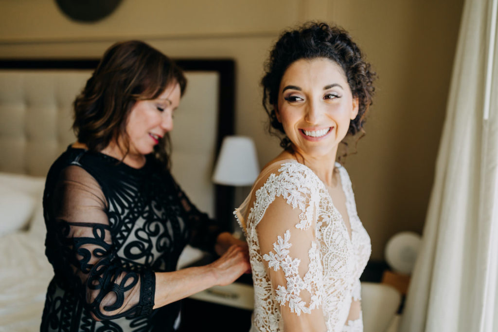 St. Pete Beach Bride in Lace and Illusion Long Sleeve Wedding Dress and Mother Getting Ready, Bride in Timeless White Illusion Lace Long Sleeve Martina Liana Wedding Dress | Tampa Bay Wedding Hair and Makeup Artist Femme Akoi Beauty Studio | Florida Wedding Venue The Hotel Zamora