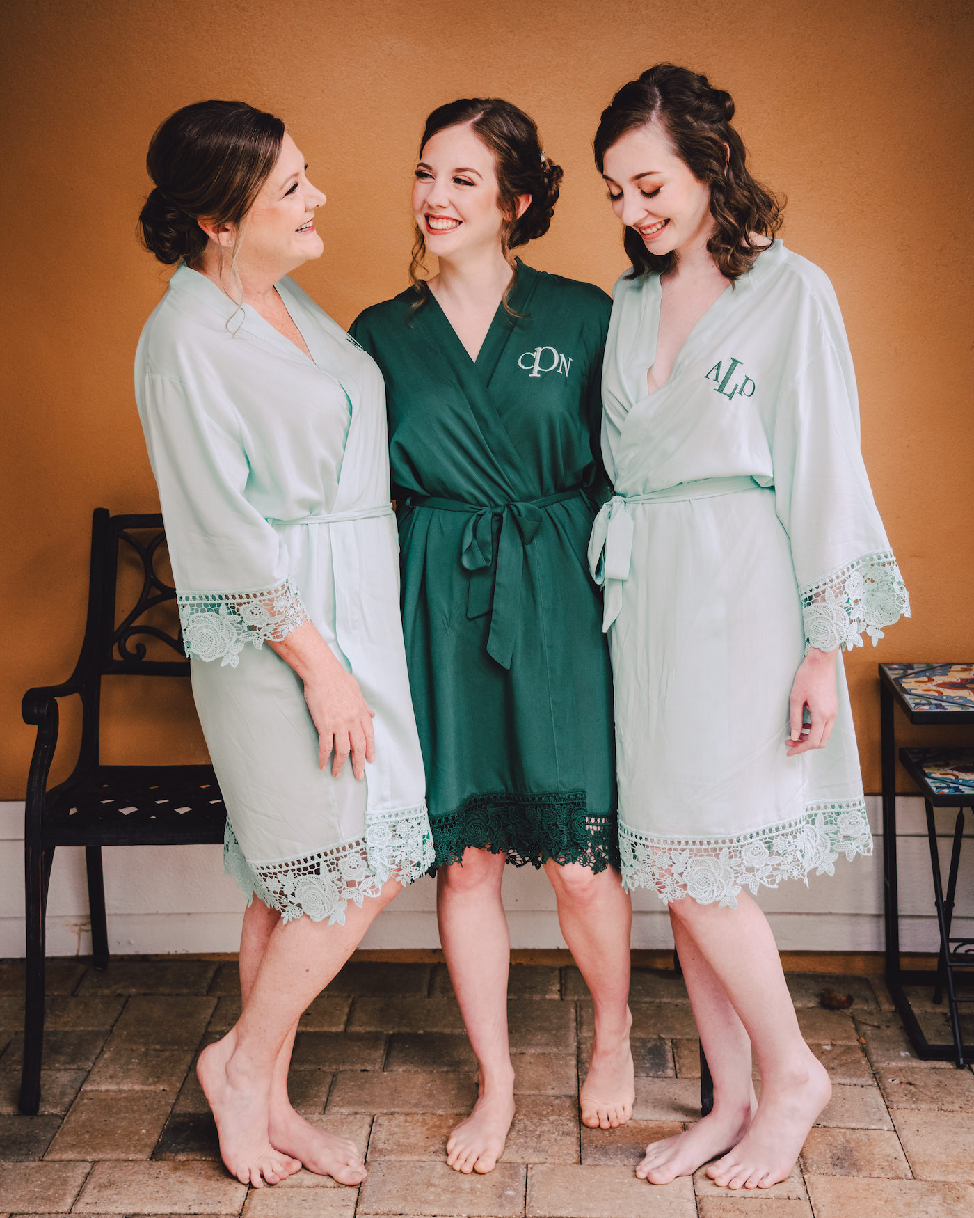 Bride and Bridesmaids Getting Ready in Sage Mint Green and Emerald Green Monogram Robes