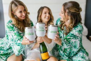 Bride and Bridesmaids Getting Ready in White and Green Tropical Leaf Print Robes with Veuve Champagne and Custom Yeti Wine Tumblers