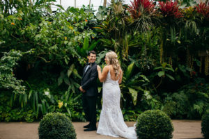 Florida Bride and Groom First Look, Bride Wearing Romantic Hayley Paige Wedding Dress, Groom in Classic black Tux | Marie Selby Botanical Gardens