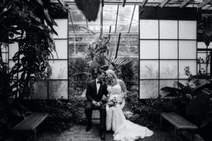 Black and White Florida Bride and Groom Intimate Embrace, Bride Wearing Romantic Hayley Paige Wedding Dress, Groom in Classic black Tux | Marie Selby Botanical Gardens