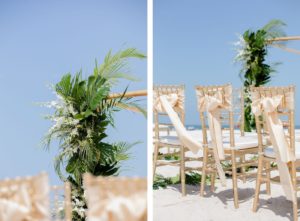 Clearwater Beach Wedding Venue Hilton Clearwater Beach | Modern Tropical Beach Wedding Ceremony with Gold Chiavari Chairs and Champagne Sash Bows and Tropical Palm Frond Leaf Floral Arrangement