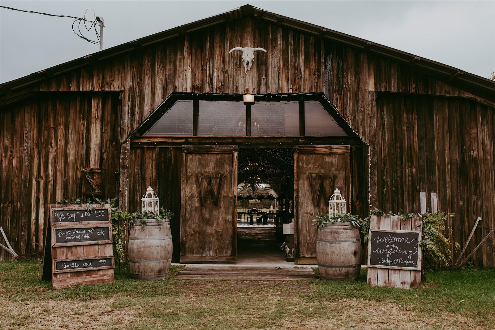 Rustic Barn Tampa Wedding with Wood Barrels and Chalkboard Welcome Signs