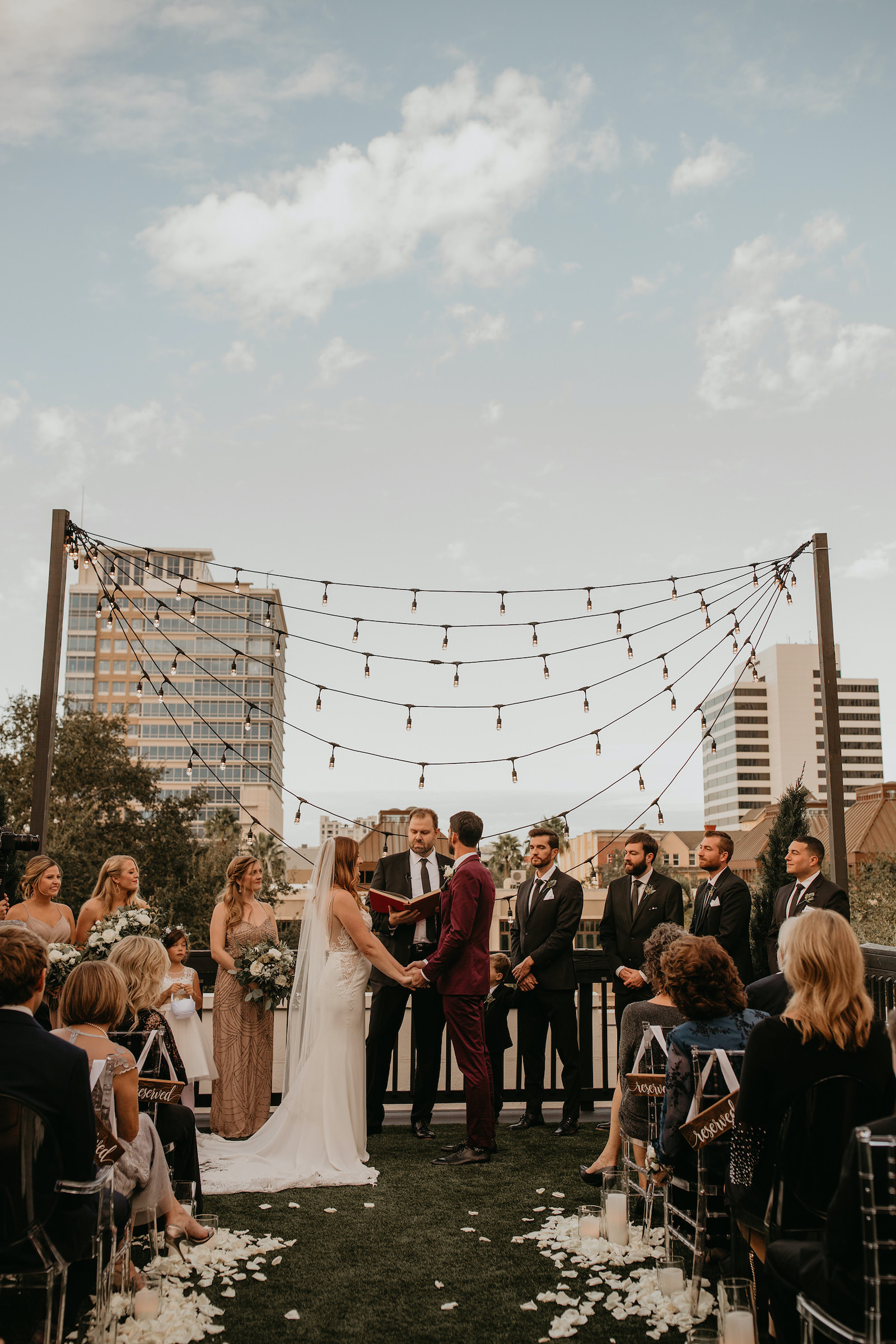 Modern Rooftop Wedding Ceremony with City Skyline and Market String Lights | Unique, Historic Downtown St. Pete Wedding Venue Station House