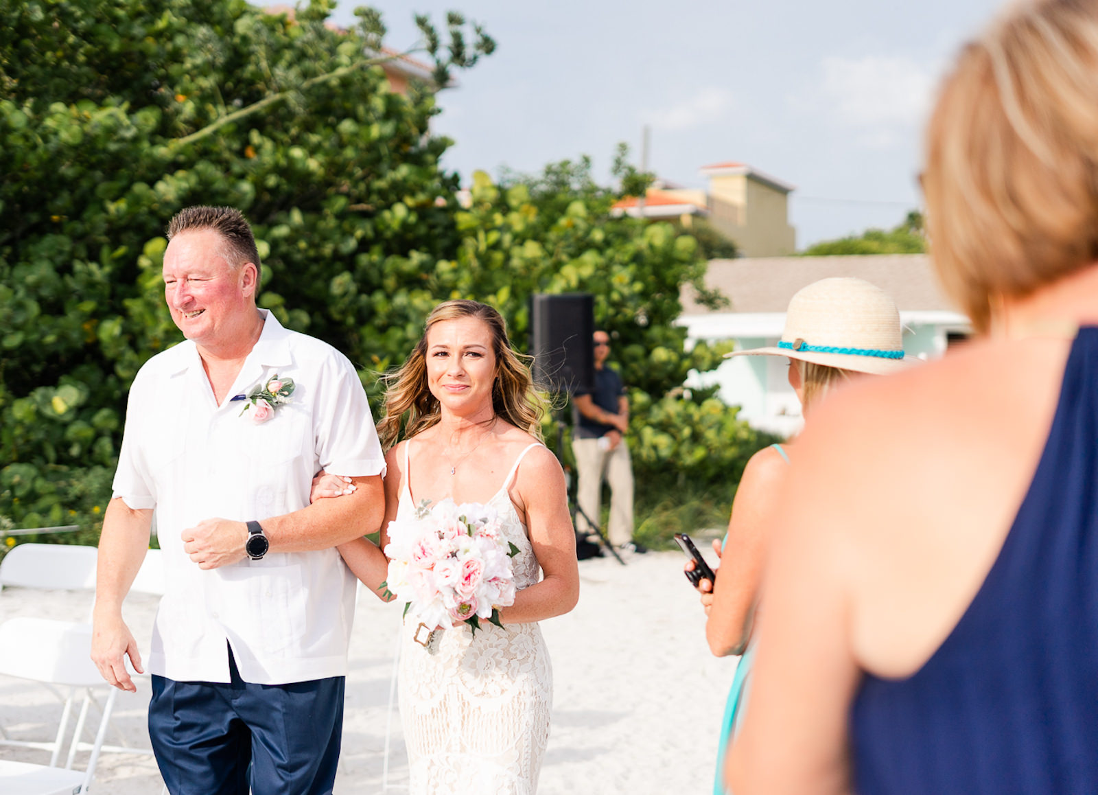 Bride Walking Down Aisle with Father during Outdoor St. Petersburg Beach Wedding Ceremony