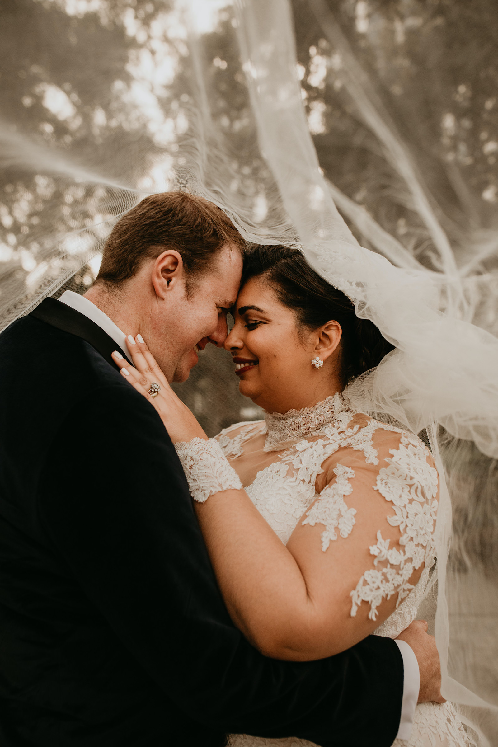 Bride and Groom Veil Shot Outdoor Wedding Portrait