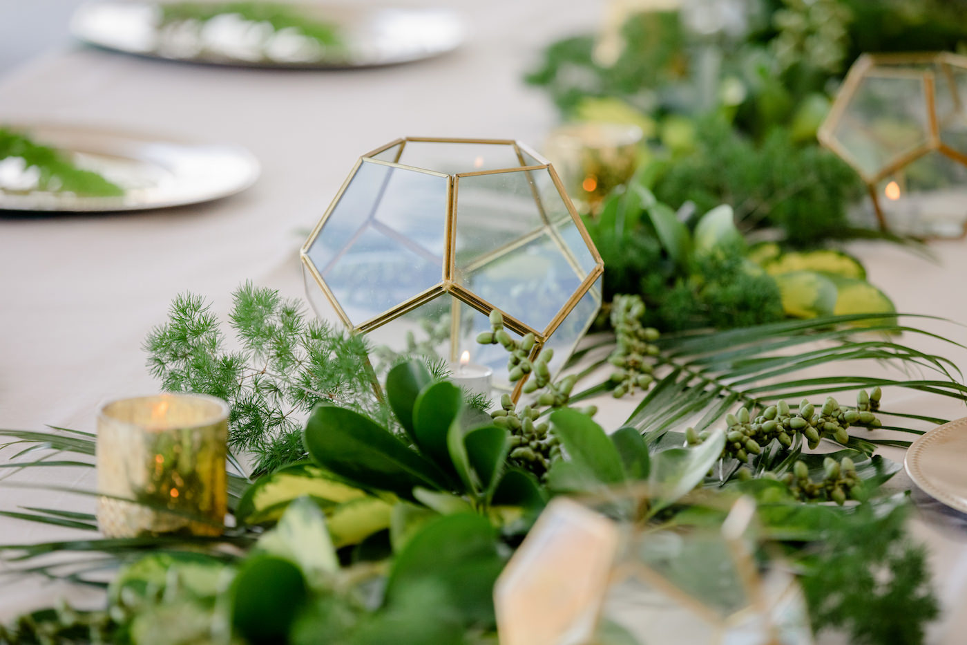 Clearwater Beach Wedding Venue Hilton Clearwater Beach | Modern Tropical Beach Outdoor Wedding Reception Terrace Feasting Table Centerpiece of Tropical Palm Frond Leaf Floral Arrangement Garland and Gold Geometric Candles