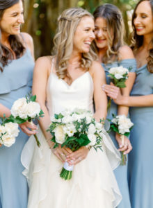 Florida Modern Bridal Party, Bridesmaids in Mix and Match Slate Gray Dresses, Holding Ivory and White Floral Bouquets with Greenery | Sarasota Wedding Planner NK Weddings