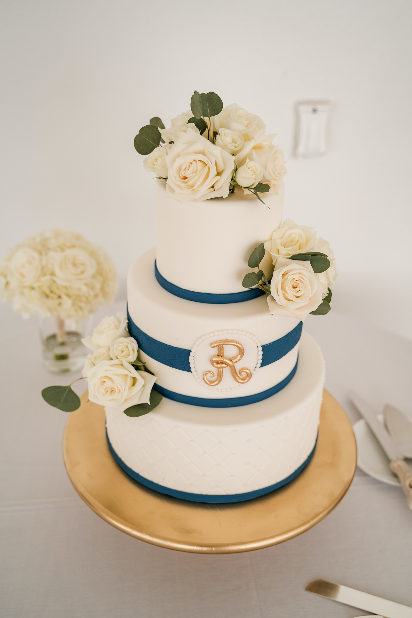 Romantic Tropical Inspired Three Tier Wedding Cake, White Fondant, Navy Stripe, Decorative Ivory Floral Accents | Florida Wedding Cake