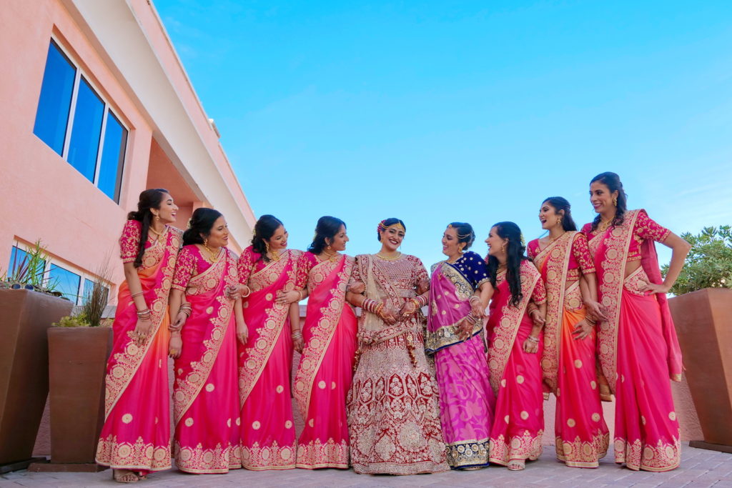 Clearwater Florida Indian Wedding | Bride and Bridesmaids in Traditional Indian Sari Garment Attire Fuchsia Pink and Gold | Tampa Wedding Hair and Makeup Artists Michele Renee The Studio