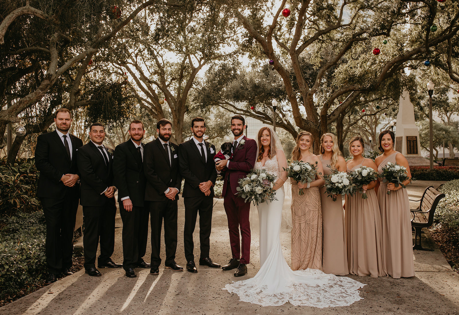 Bridal Party Portrait | Bridesmaids in Neutral Taupe Tan and Groomsmen Black with Burgundy Groom's Suit
