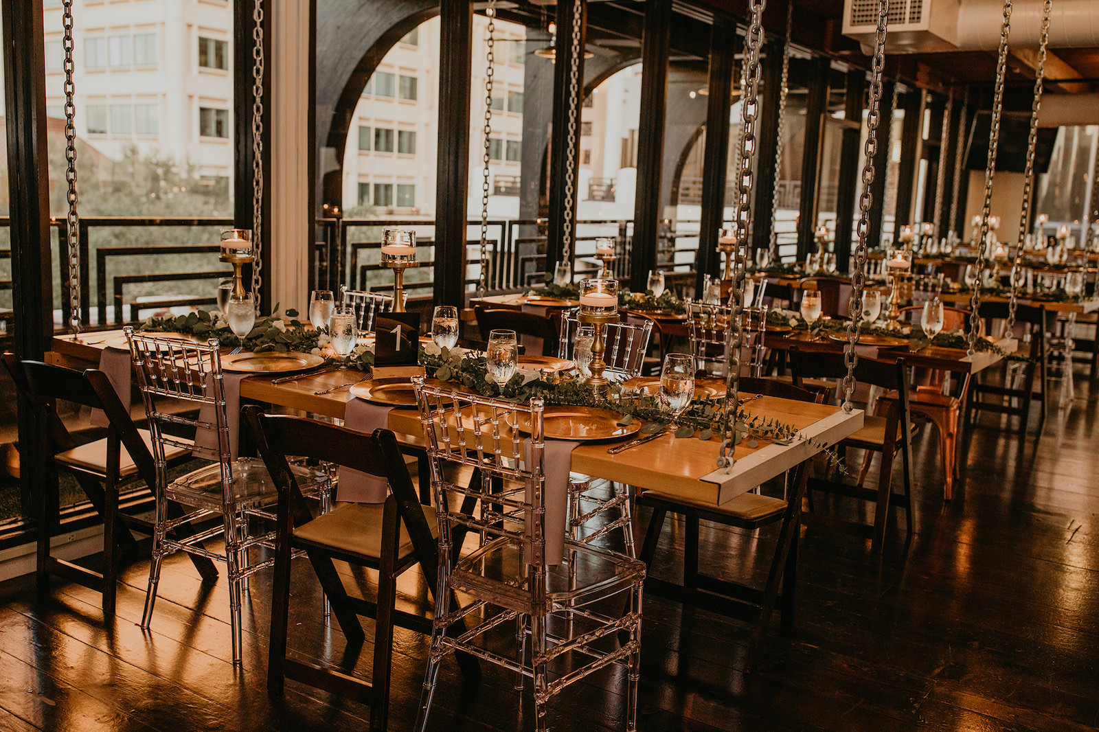 Boho Industrial Wedding Reception with Wooden Tables and Greenery | Unique, Historic Downtown St. Pete Wedding Venue Station House