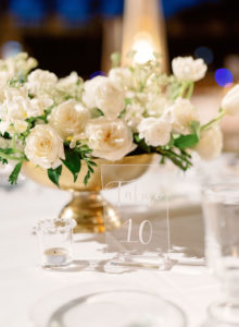 Romantic, Modern Wedding Reception Decor, Low Floral Centerpiece with Gold Vase, Ivory Roses, White Florals and Greenery, Clear Acrylic Table Number | Luxury Florida Wedding Planner NK Weddings