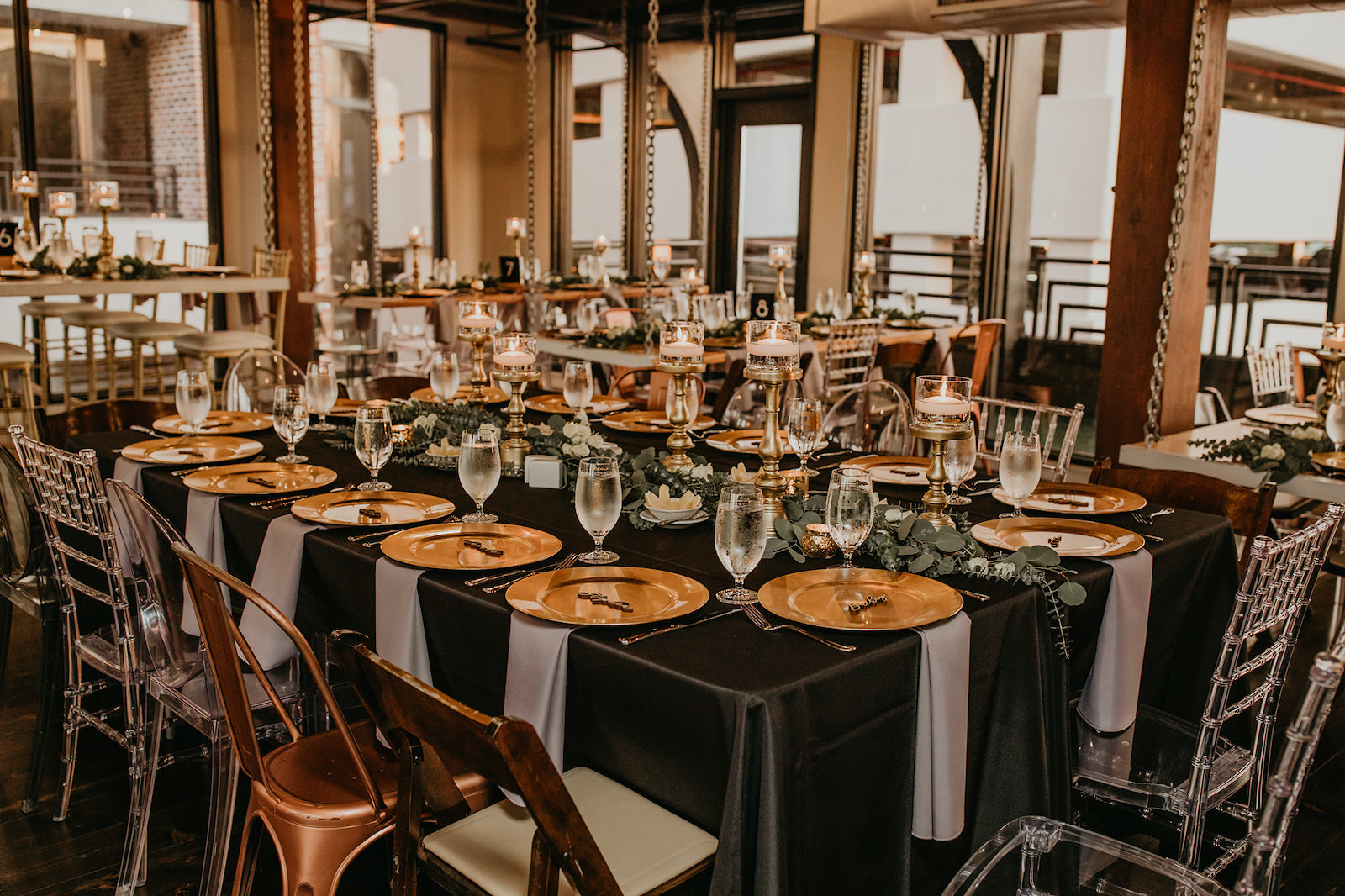 Boho Industrial Wedding Reception with Gold Chargers and Greenery | Unique, Historic Downtown St. Pete Wedding Venue Station House
