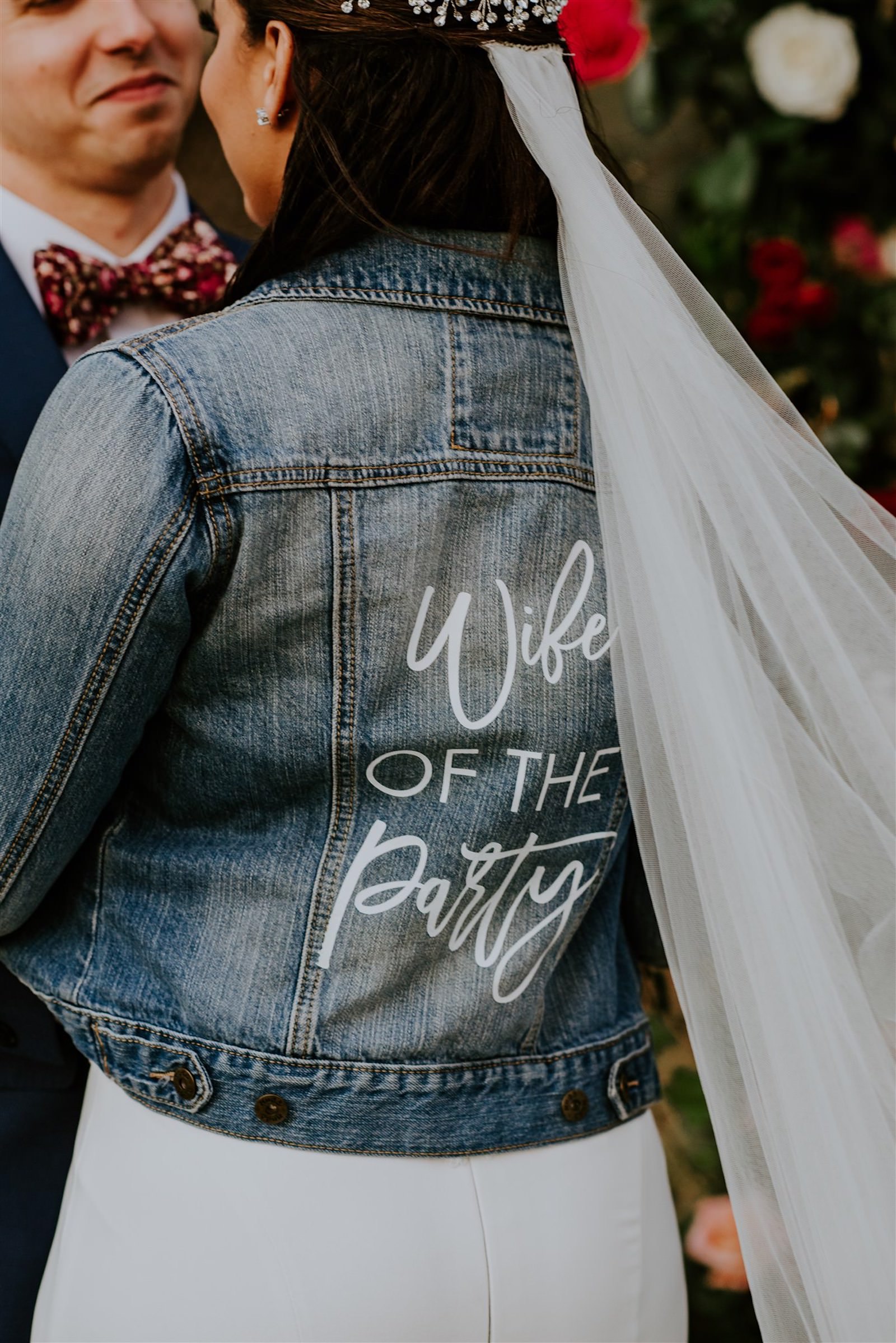 Bride and Groom Outdoor Portrait | Bride Wearing Enzoani Lace Mermaid Gown with Cathedral Veil and Custom Denim Jean Jacket | Wife of the Party