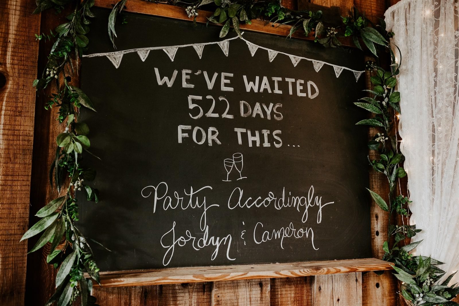 Wedding Chalkboard Sign with Greenery Garland | We've Waiting Days For This Party Accordingly