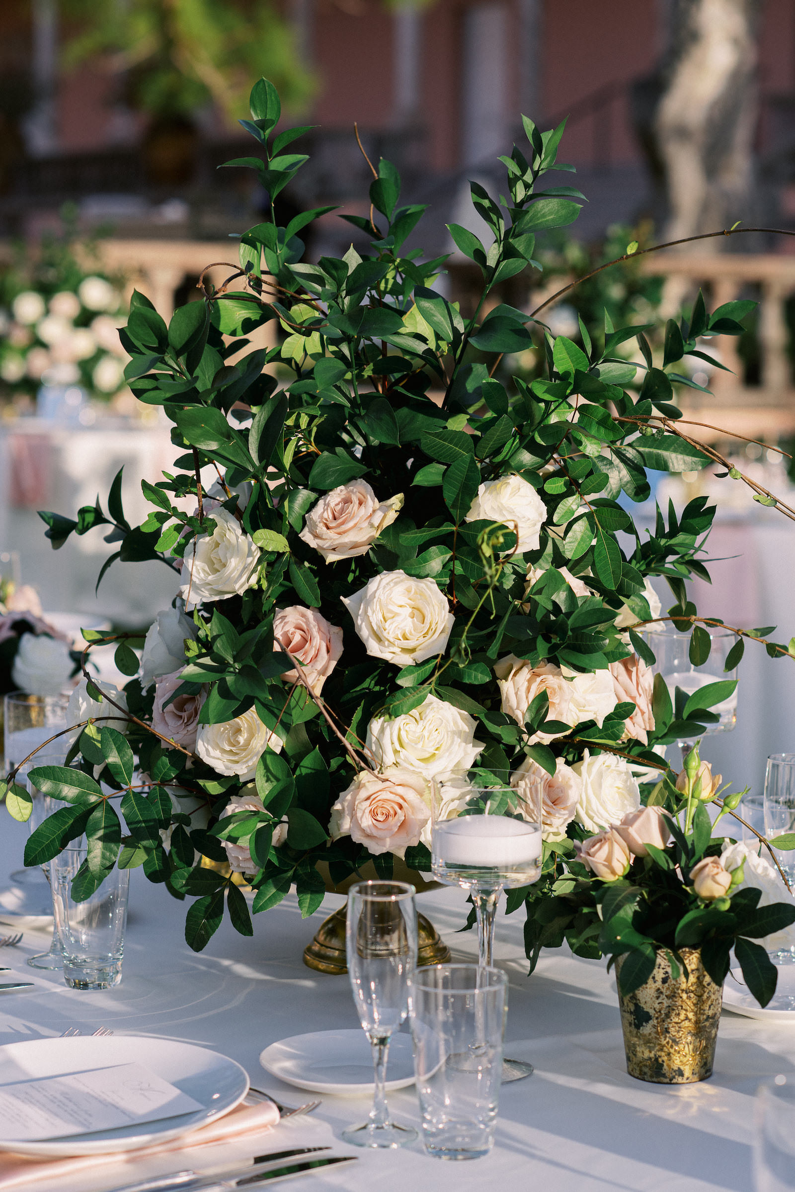 Romantic Garden Inspired Centerpiece, Fairytale Florals with Lush Greenery, Ivory and Blush Pink Roses, Mercury Glass Votive for Stems, Glass Candles | Luxury Florida Wedding Planner NK Weddings