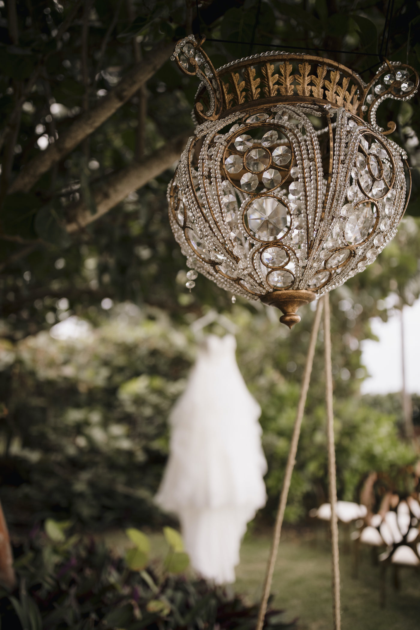 Wedding Dress Hanger Shot | Gold and Crystal Chandelier Lamp