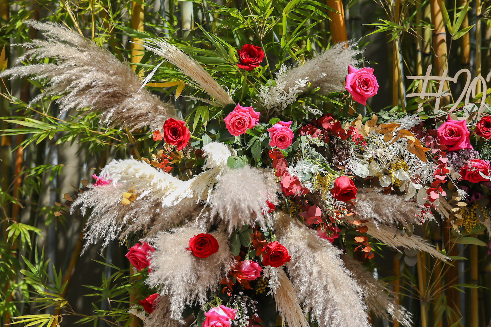 Whimsical Boho Wedding Floral Arrangement With Pampas Grass And Vibrant Roses Tampa Wedding Florist Monarch Events And Design Marry Me Tampa Bay Most Trusted Wedding Vendor Search And Real