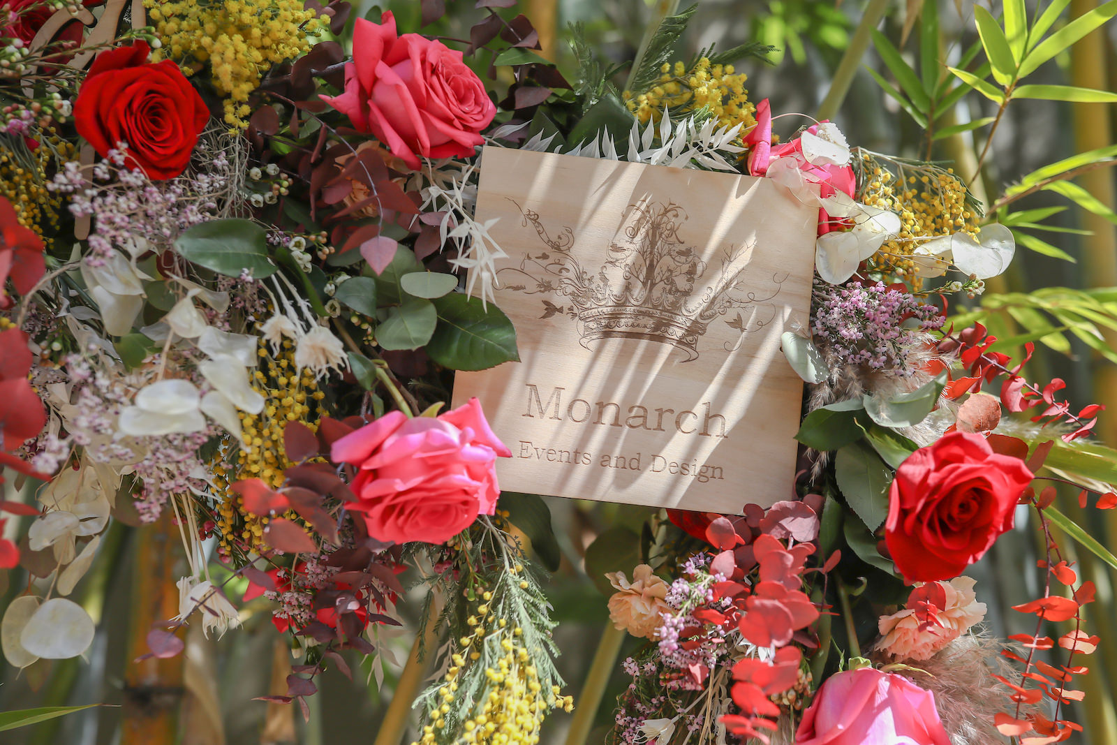 Whimsical Boho Wedding Floral Arrangement with Pampas Grass, Vibrant Roses and Eucalyptus | Tampa Wedding Florist Monarch Events and Design