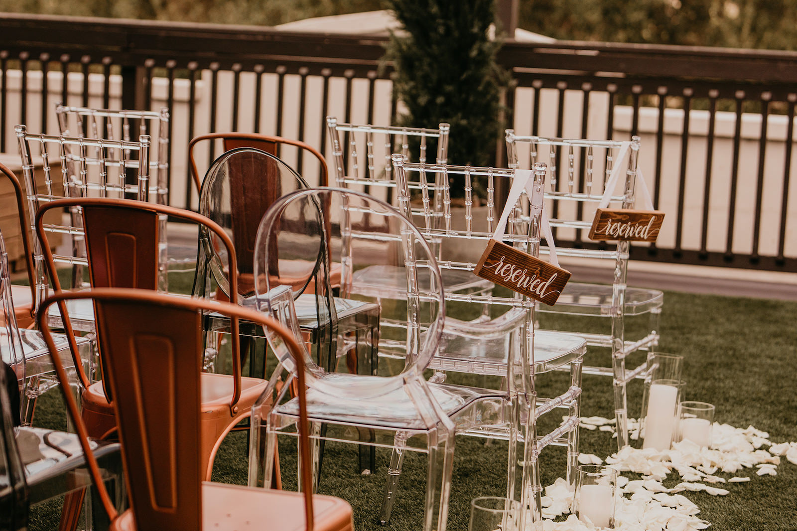 Modern Rooftop Wedding Ceremony with Mismatched Clear Acrylic Chairs and Industrial Copper Chairs