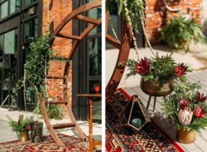 Round Moon Arch with Greenery Wedding Floral Arrangements with Maroon Burgundy Red Protea and Gold Geometric Candle Lanterns | Fall Wedding Inspiration