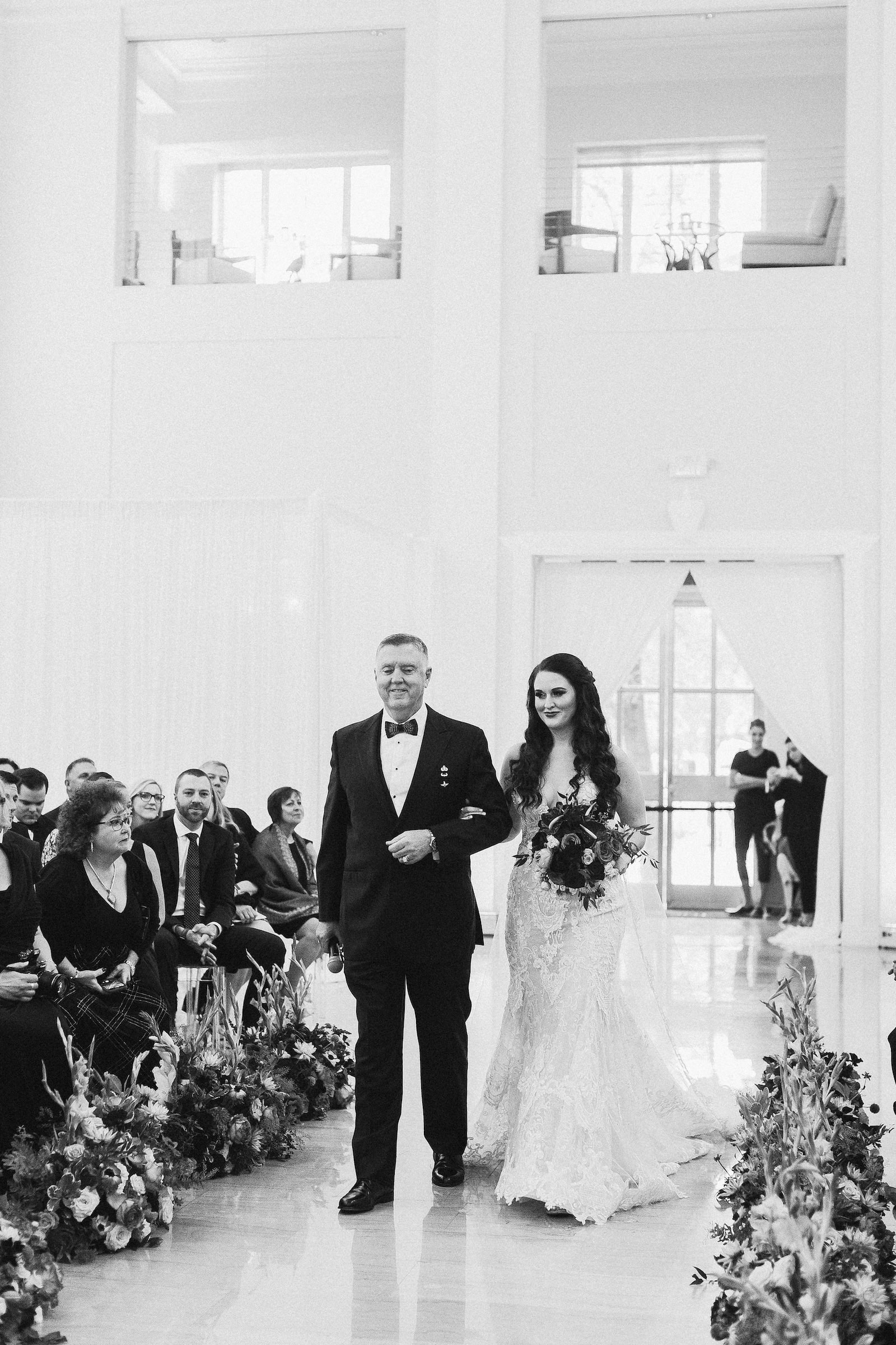 Indoor Downtown Tampa Wedding Ceremony at Tampa Wedding Venue The Vault | Bride Walking Down Aisle with Father | Black and White Wedding Photography