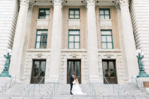 Florida Bride and Groom on Steps of Downtown Tampa Boutique Historic Hotel Le Meridien
