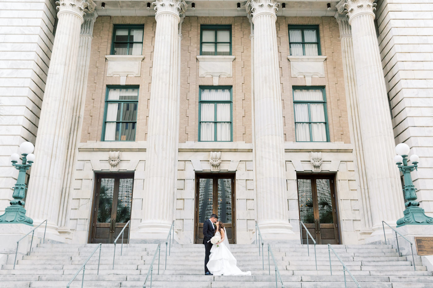 Florida Bride and Groom on Steps of Downtown Tampa Boutique Historic Hotel Le Meridien