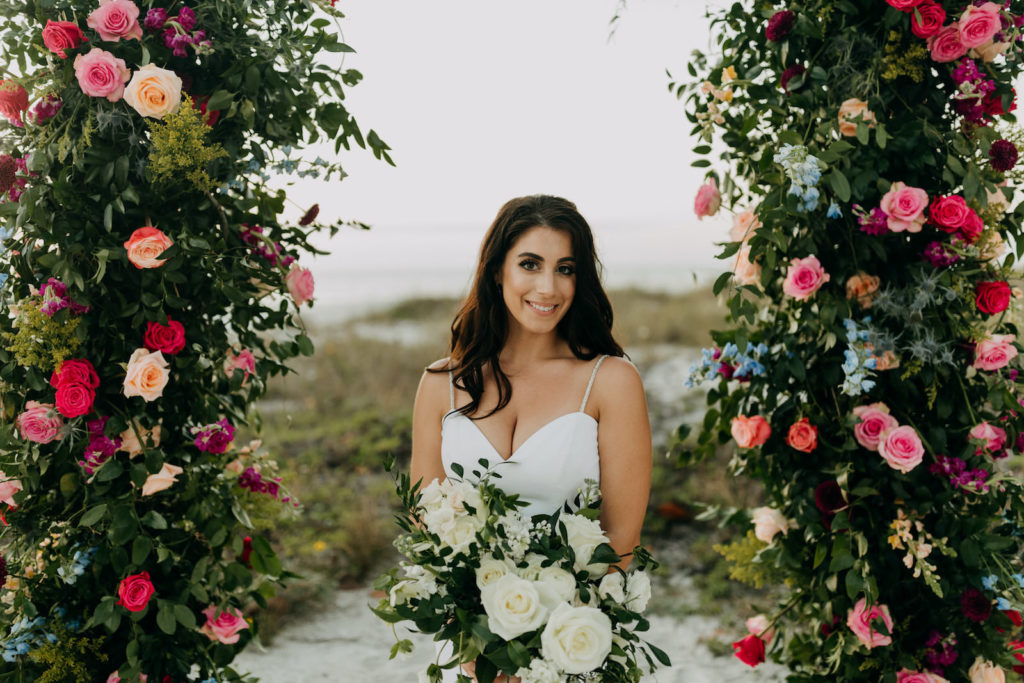 Blush Pink and Fuchsia Roses and Greenery Wedding Ceremony Backdrop Arrangements | Neutral Ivory Roses and Greenery Bridal Bouquet | Amber McWhorter Photography