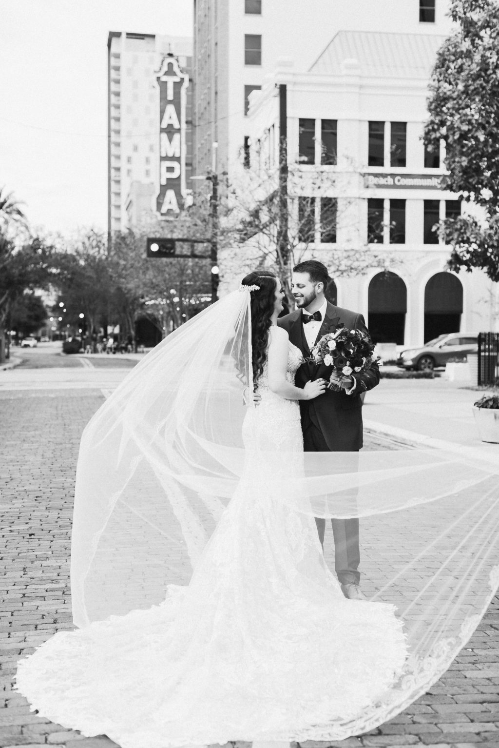 Bride and Groom Outdoor Downtown Tampa Wedding Portrait Veil Shot | Black and White Wedding Photography