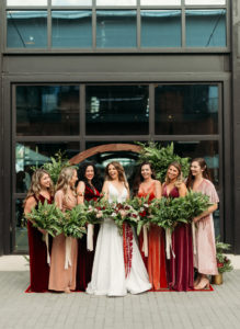 Bride and Bridesmaids Bridal Party Outdoor Wedding Portrait | Mismatched Velvet Blush Pink Maroon Burgundy Red Bridesmaid Dresses with Greenery Bridesmaid Bouquets | Wild Boho Loose Organic Greenery Bridal Bouquet with Ferns Blush Pink Roses and Protea and Red Amaranthus | Dewitt for Love Photography