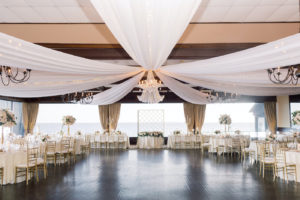 Classic Elegant Wedding Reception Decor, White Ceiling Draping, Chandeliers, Gold Chiavari Chairs, Low and Tall Floral Centerpieces | Tampa Bay Wedding Planner Special Moments Event Planning | Tampa Bay Wedding Reception Venue The Rusty Pelican