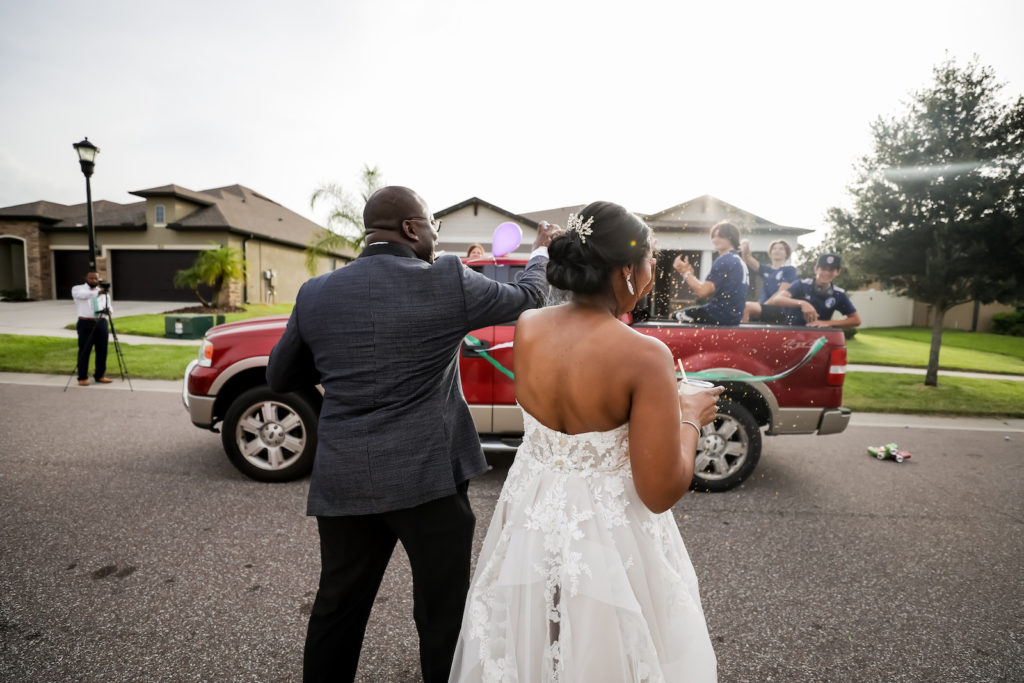 Florida Bride and Groom During COVID Wedding Reception, Drive By Honk and Cheer for The Newlyweds at Valrico Private Residence Reception | Tampa Bay Wedding Photographer Lifelong Photography Studios