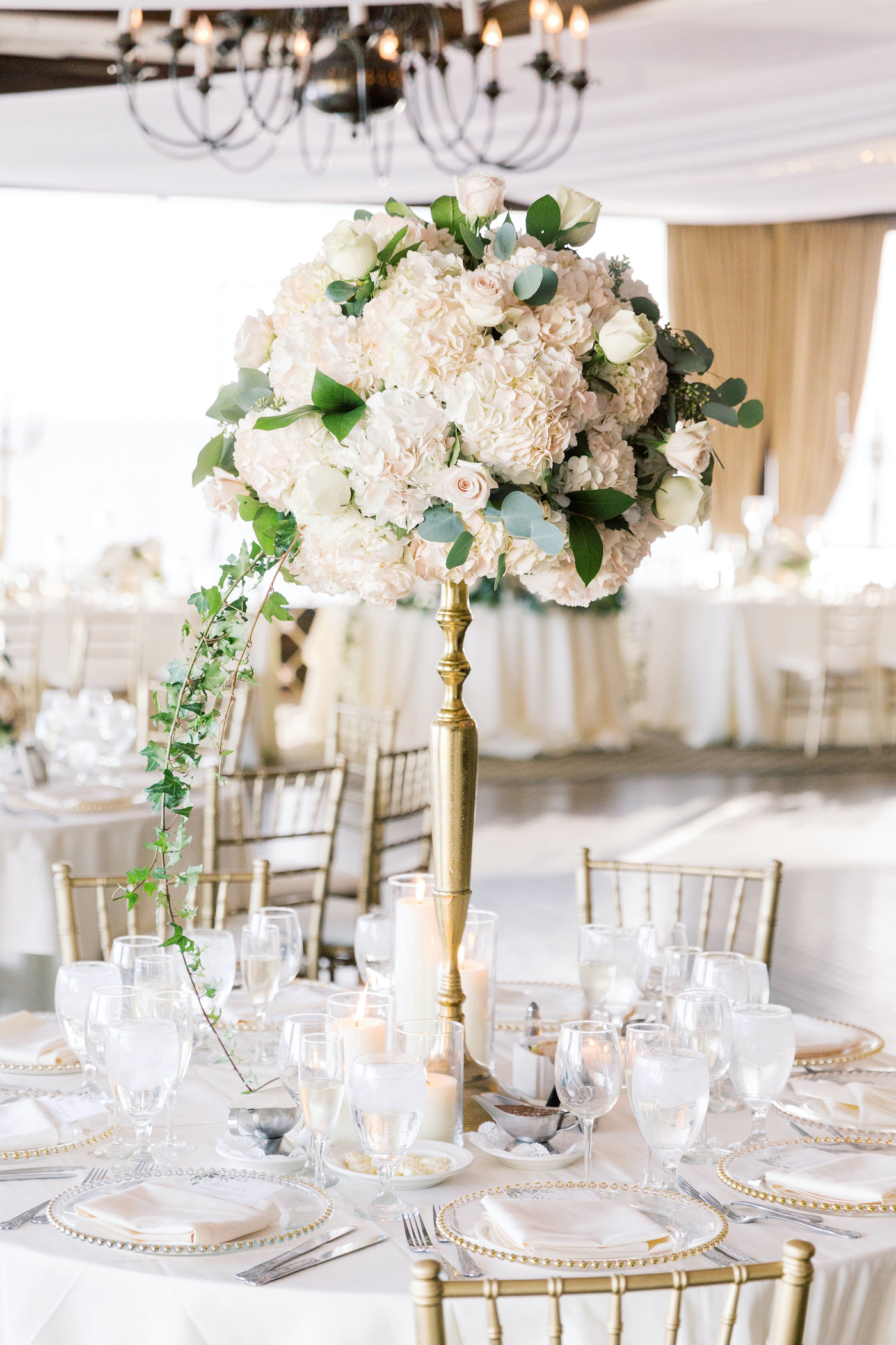 Classic Elegant Wedding Reception Decor, Tall Floral Centerpiece, Gold Candelabra with White Hydrangeas, Blush Pink Roses, Eucalyptus and Greenery Centerpiece | Tampa Bay Wedding Planner Special Moments Event Planning | Wedding Florist, Candelabra and Chargers Rentals Gabro Event Services