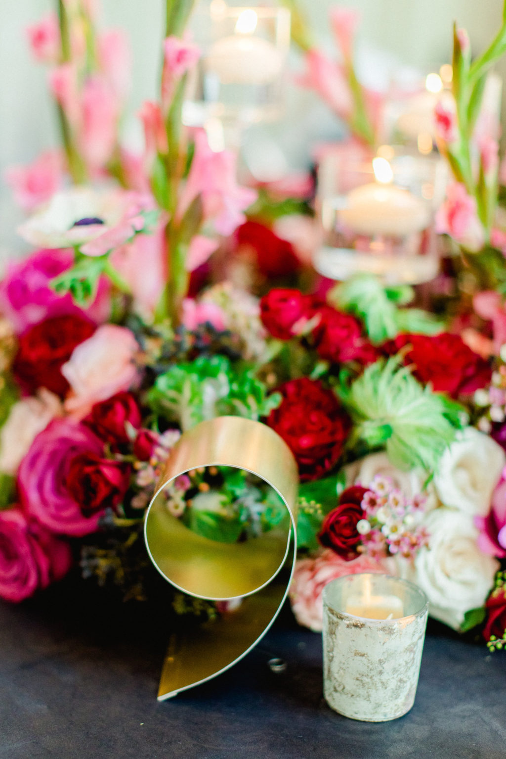 Colorful Luxury Tampa Wedding Centerpieces with Pink and Red Flowers and Gold Metal Table Numbers