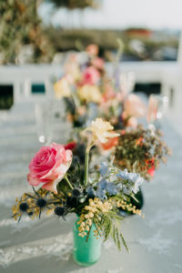 Outdoor St. Pete Tampa Florida Elopement Reception Table Centerpiece with Bud Vases of Pink Roses, Blue Delphinium, Buttercup, Blue Thistle and Greenery